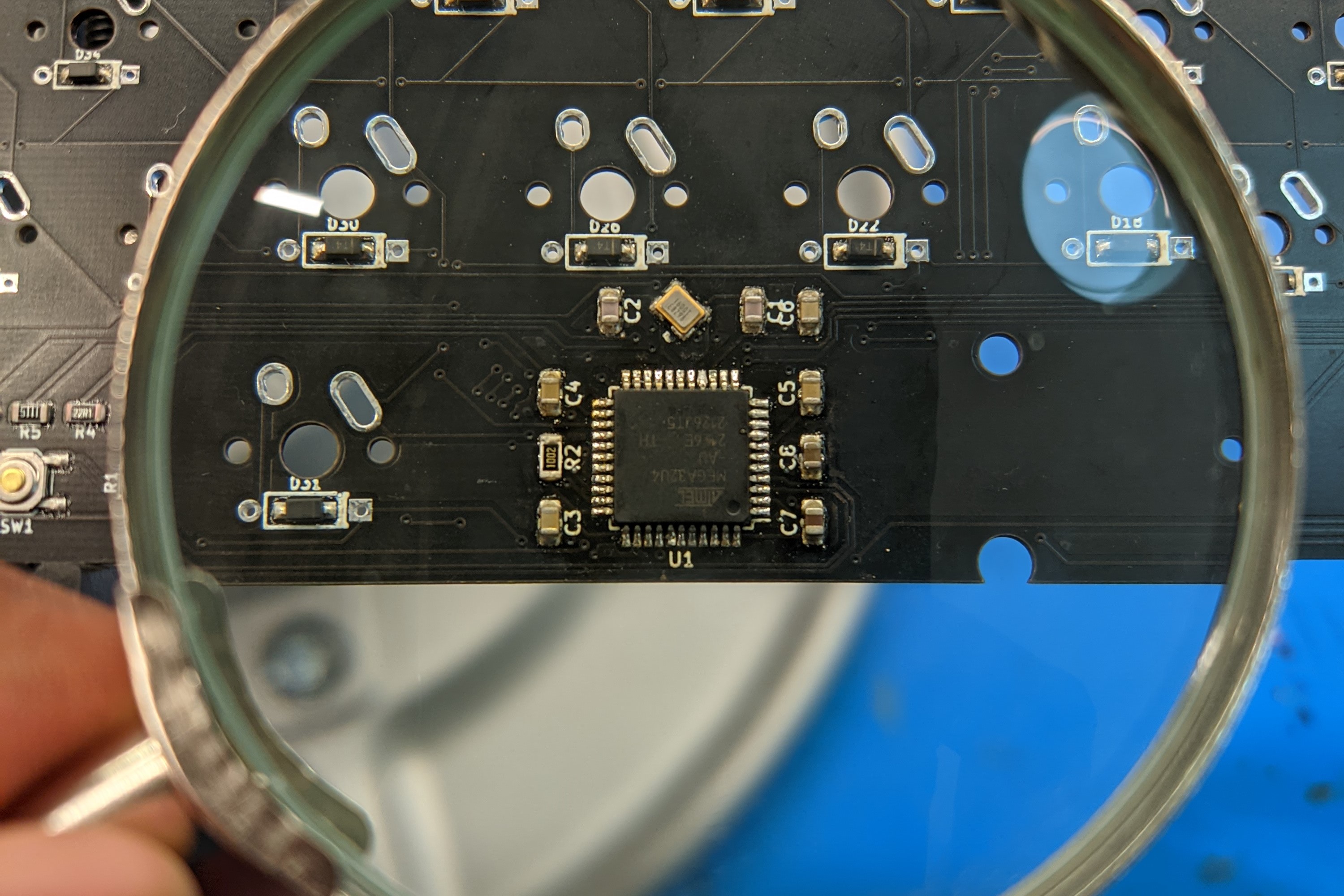 A closeup of the ATMEGA32U4 microprocessor I used on my PCB.